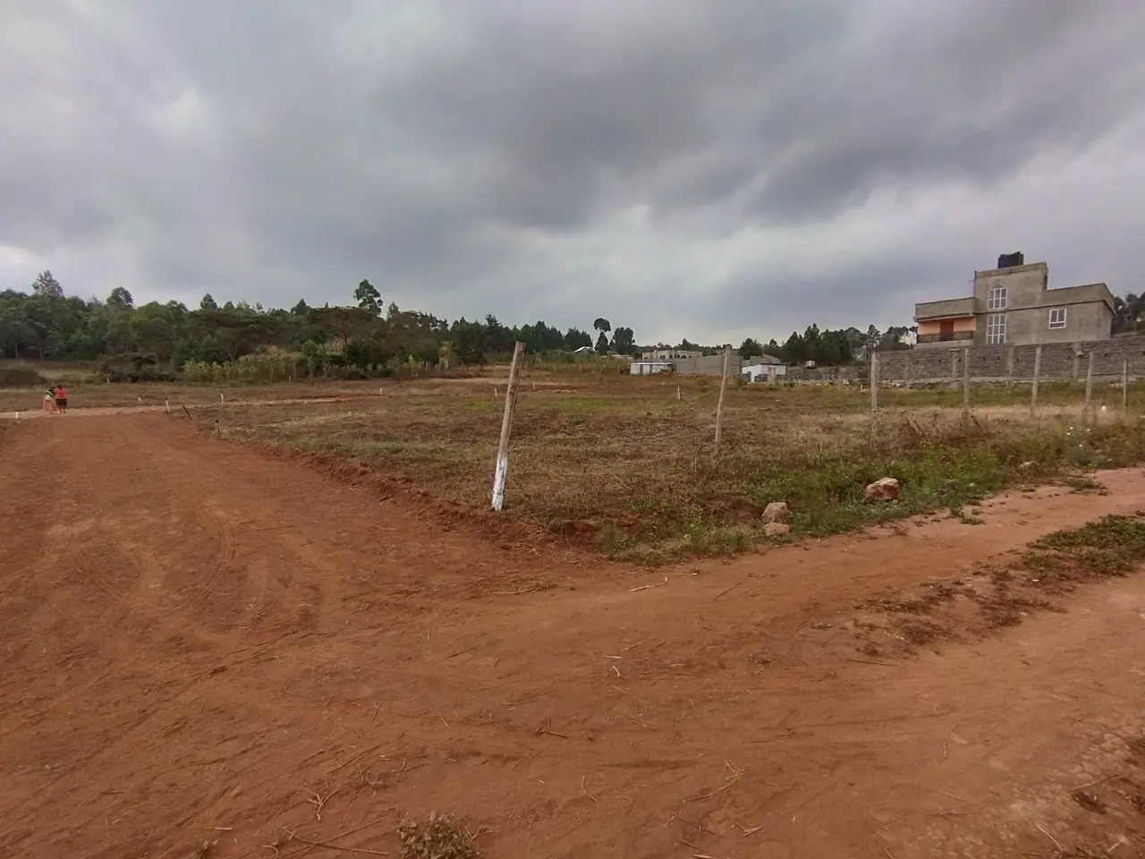 Entry to gated community with house in bg